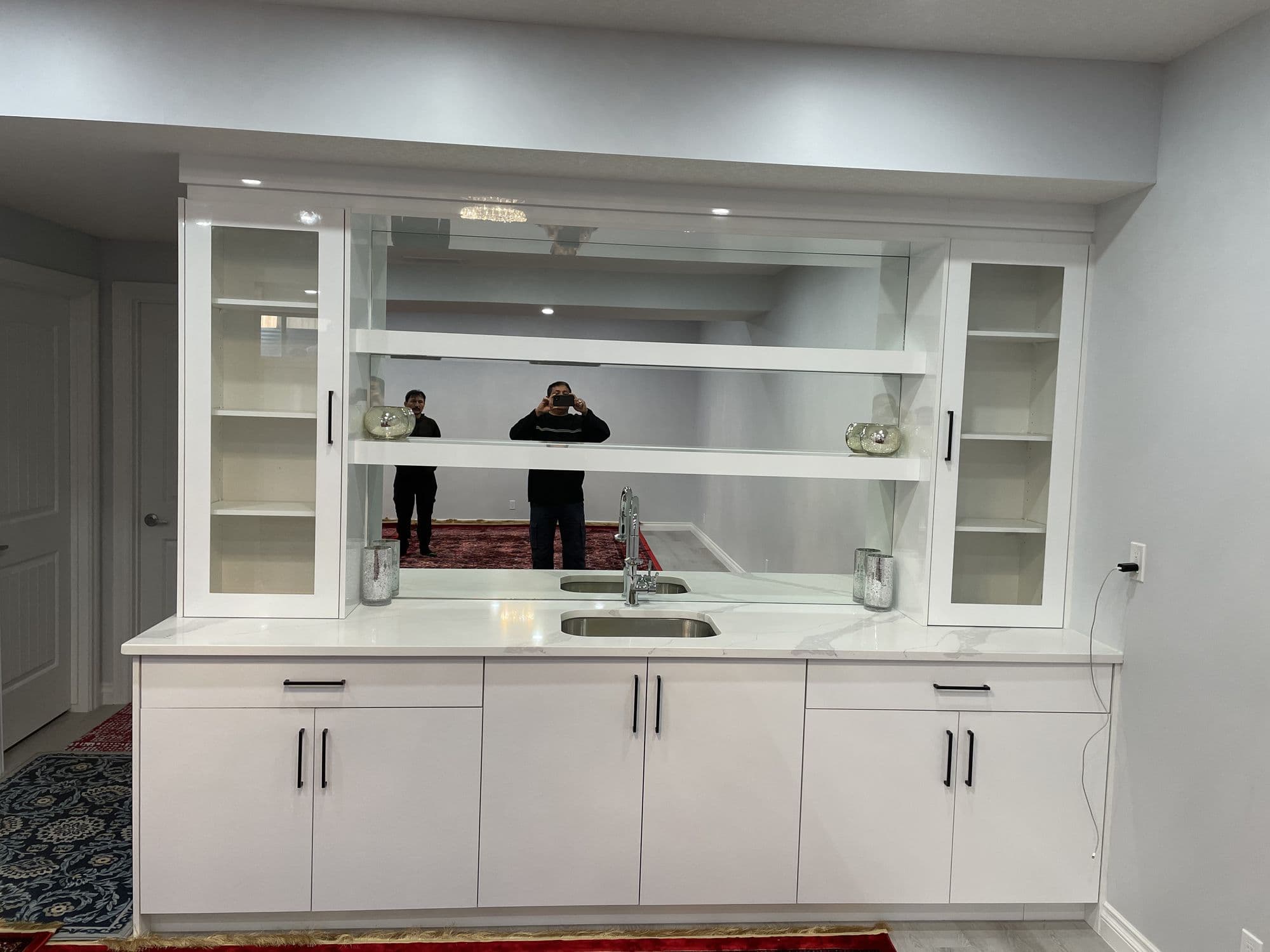 Custom carpentry work in Calgary home featuring built-in shelving and storage solutions