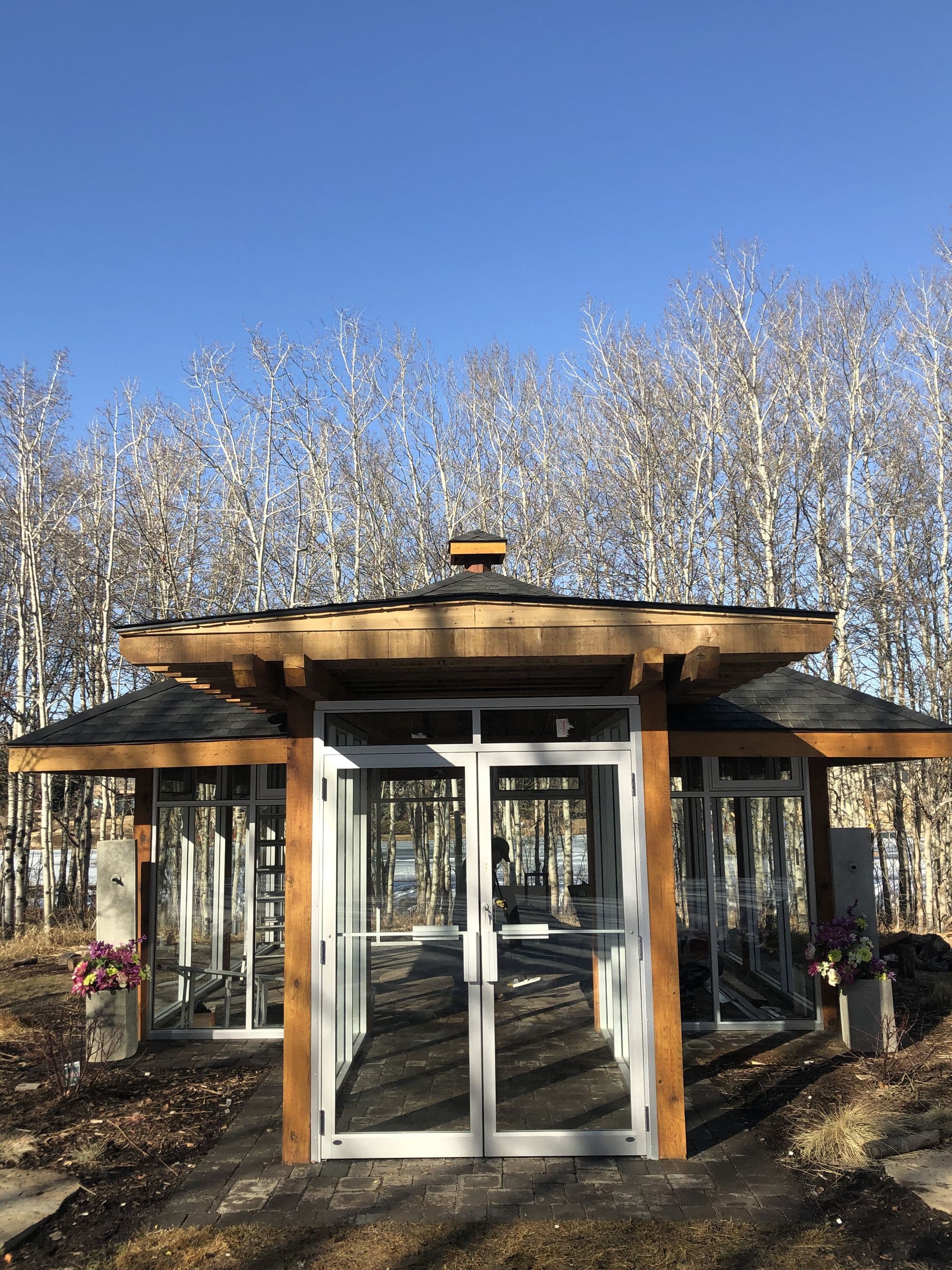 Exterior renovation in Calgary featuring custom deck and landscaping