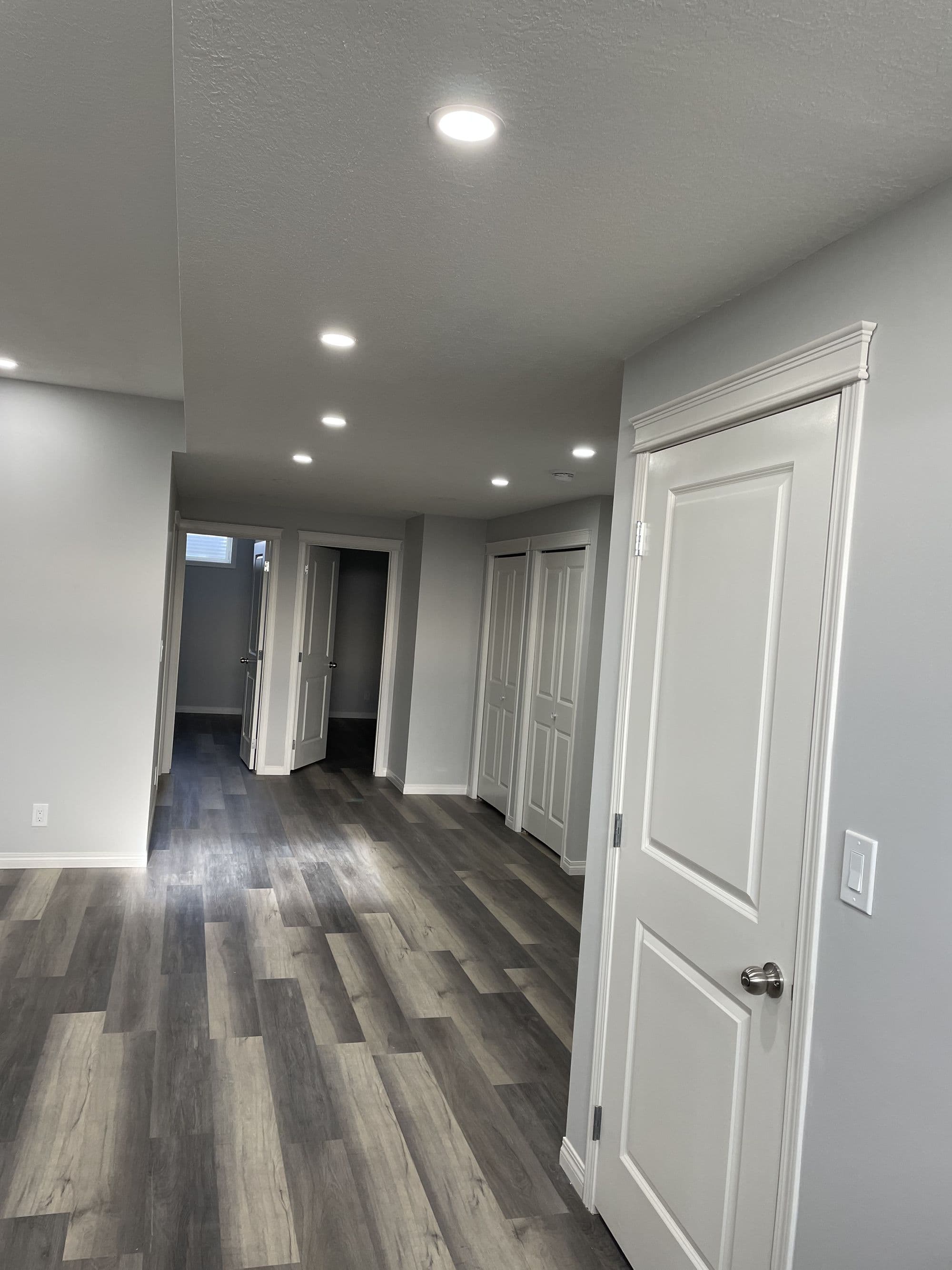 Luxury basement development in Calgary with custom entertainment space and modern finishes